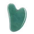 Soft green aventurine gua sha stone with satin finish, heart-shaped facial massage tool